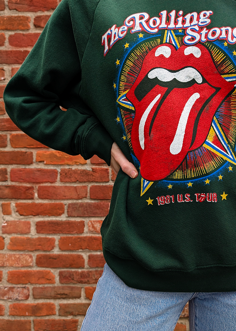 Rolling Stones slouchy fit raglan crew neck sweatshirt in hunter green featuring the iconic tongue logo and "1981 US TOUR" at front. Officially licensed, made in the USA, and 100% french terry cotton