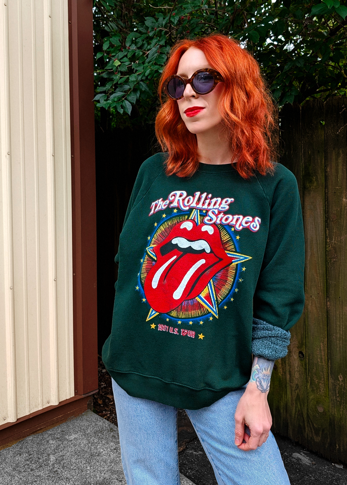 Rolling Stones slouchy fit raglan crew neck sweatshirt in hunter green featuring the iconic tongue logo and "1981 US TOUR" at front. Officially licensed, made in the USA, and 100% french terry cotton